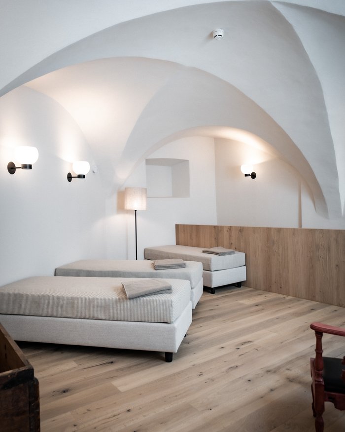 Bright room with two single beds and vaulted ceiling